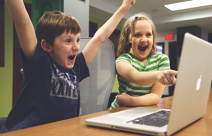 happy children using computer